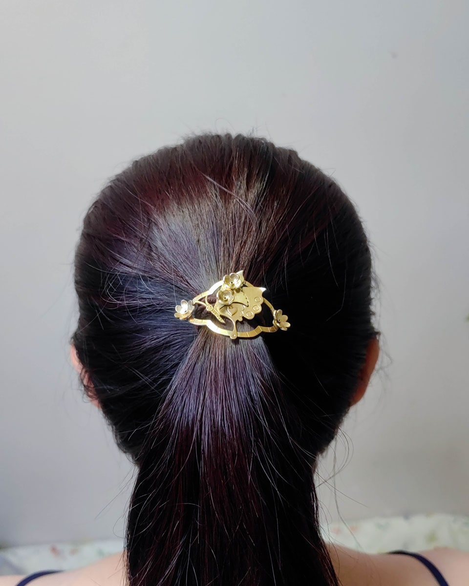 Butterfly hair cuff with a smiley face in brass with floral and heart designs, pony tail hook handmade by fake plastic love
