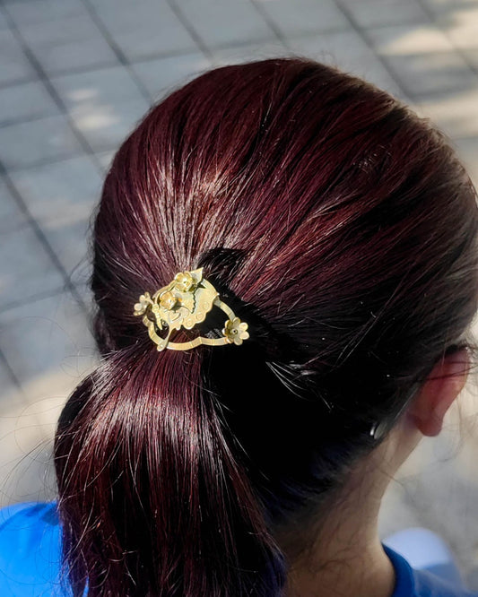 Butterfly hair cuff with a smiley face in brass with floral and heart designs, pony tail hook handmade by fake plastic love