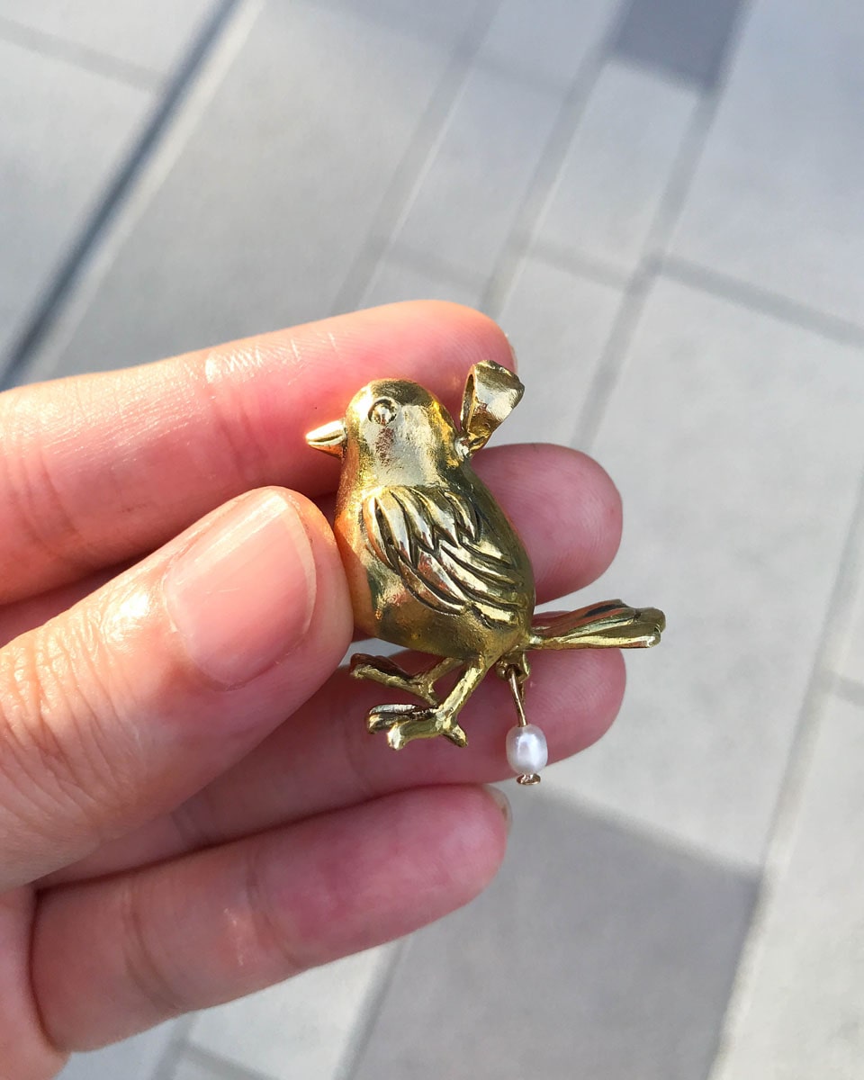 handmade brass pooping bird pendant that poops out a freshwater pearl, by fake plastic love