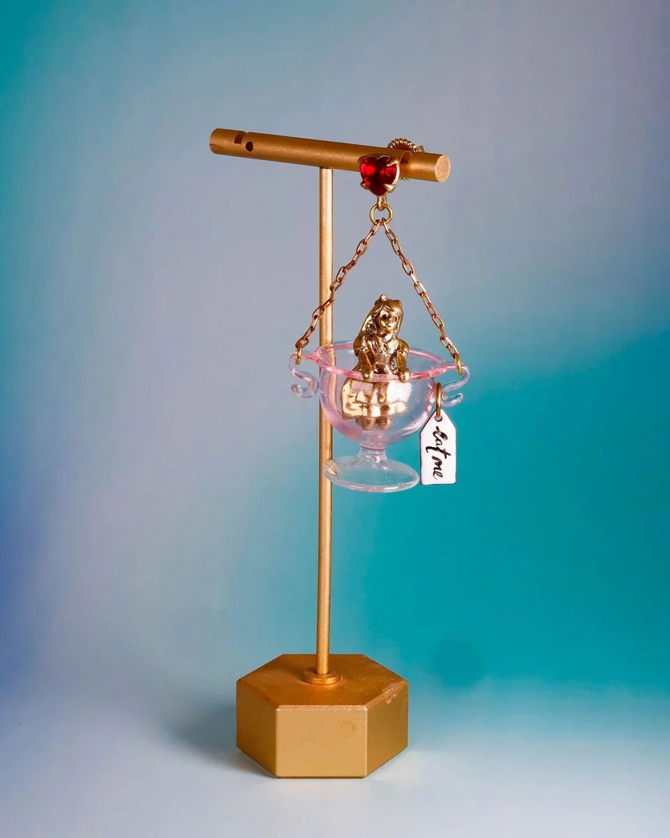 Handmade Alice in Wonderland earring/pendant with glass bowl, brass figure, and "Eat Me" vitreous enamel tag, handmade by fake plastic love