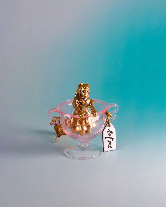 Handmade Alice in Wonderland earring/pendant with glass bowl, brass figure, and "Eat Me" vitreous enamel tag, handmade by fake plastic love