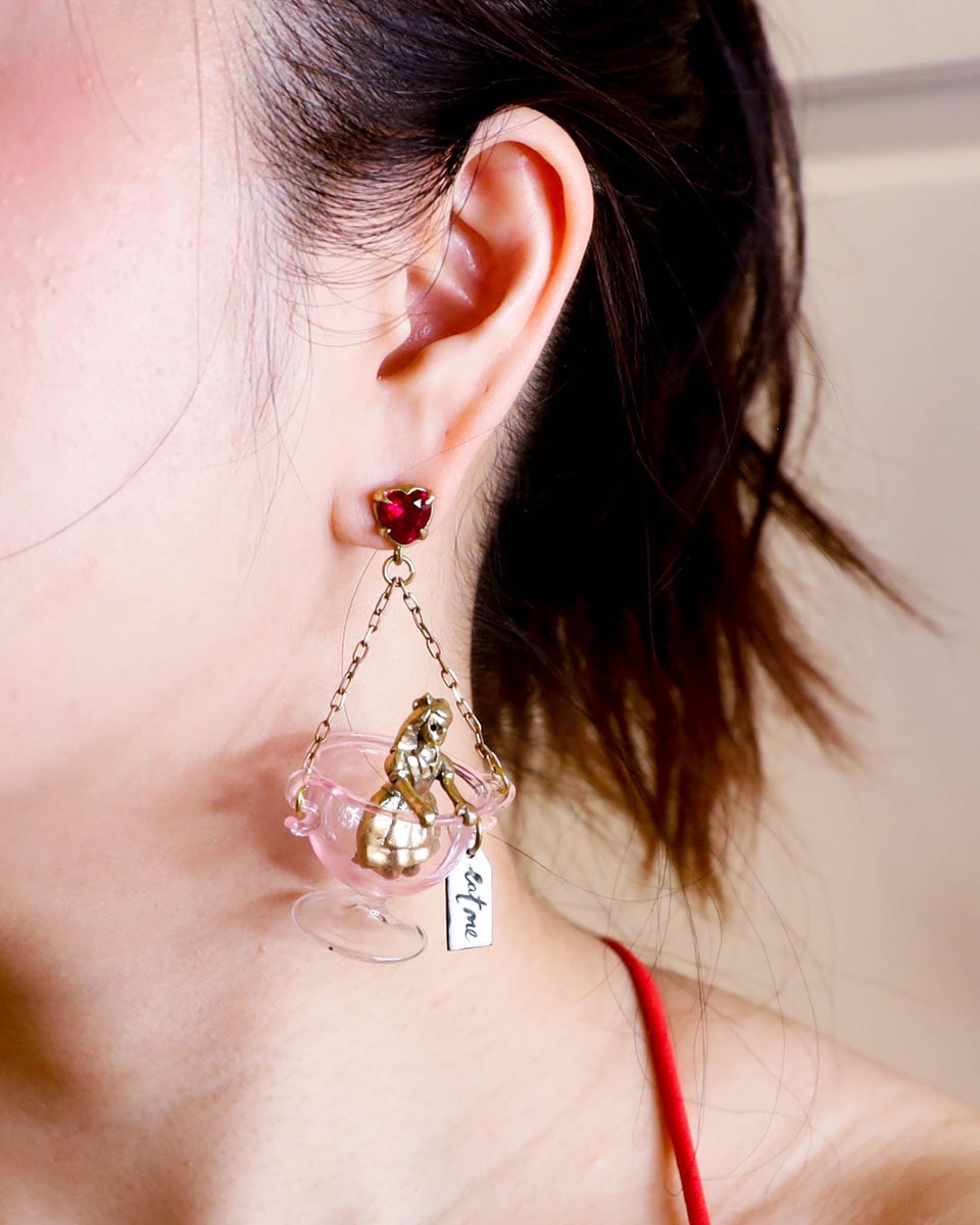 Handmade Alice in Wonderland earring/pendant with glass bowl, brass figure, and "Eat Me" vitreous enamel tag, handmade by fake plastic love