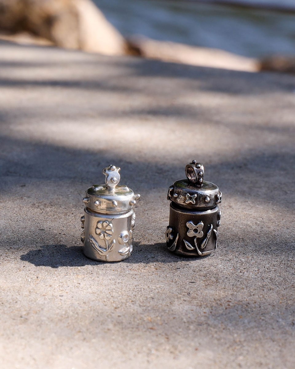 A solid sterling silver container locket pendant with floral details, hand-carved with wax cast into silver, with a functional hinged lid. Handmade by fake plastic love