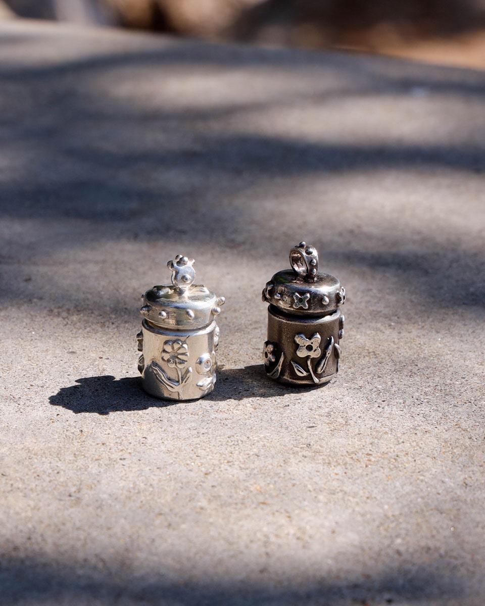 A solid sterling silver container locket pendant with floral details, hand-carved with wax cast into silver, with a functional hinged lid. Handmade by fake plastic love