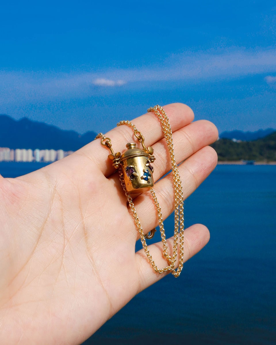 The Alchemist Locket Necklace, a handmade brass tiny container locket with cz stones and flowers details with gold plated chain, crafted by fake plastic love