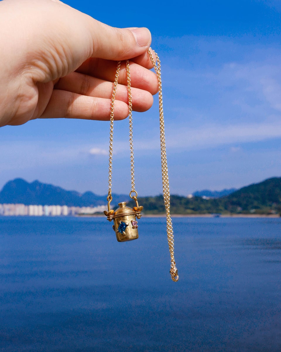 The Alchemist Locket Necklace, a handmade brass tiny container locket with cz stones and flowers details with gold plated chain, crafted by fake plastic love