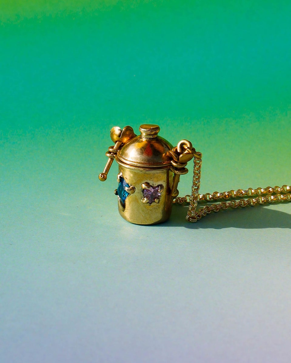 The Alchemist Locket Necklace, a handmade brass tiny container locket with cz stones and flowers details with gold plated chain, crafted by fake plastic love