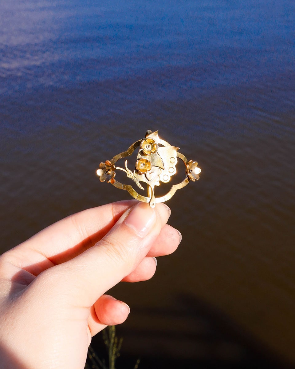 Butterfly hair cuff with a smiley face in brass with floral and heart designs, pony tail hook handmade by fake plastic love