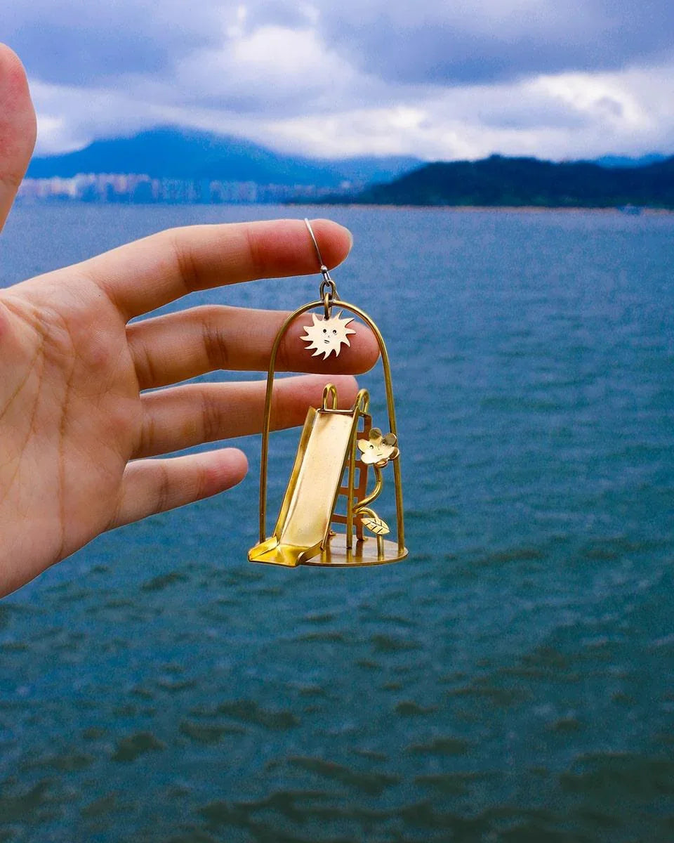 Sunny Day Playground Earrings, handmade miniature slide and seesaw with a kinetic element, made with metal folding technique, by fake plastic love