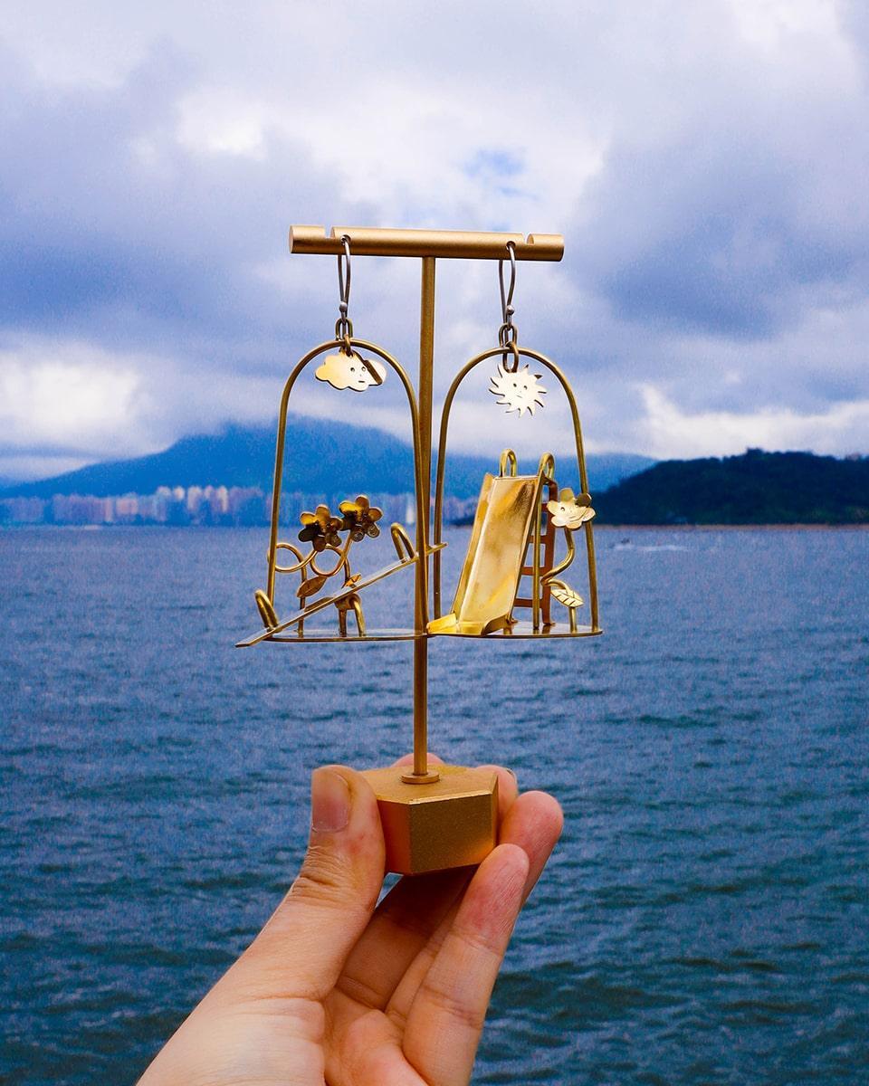 Sunny Day Playground Earrings, handmade miniature slide and seesaw with a kinetic element, made with metal folding technique, by fake plastic love