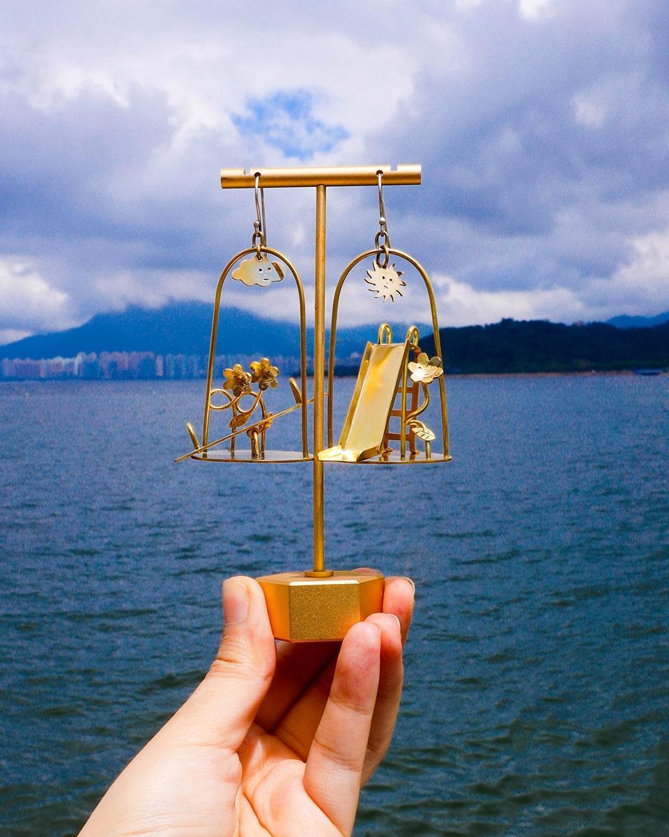 Sunny Day Playground Earrings, handmade miniature slide and seesaw with a kinetic element, made with metal folding technique, by fake plastic love