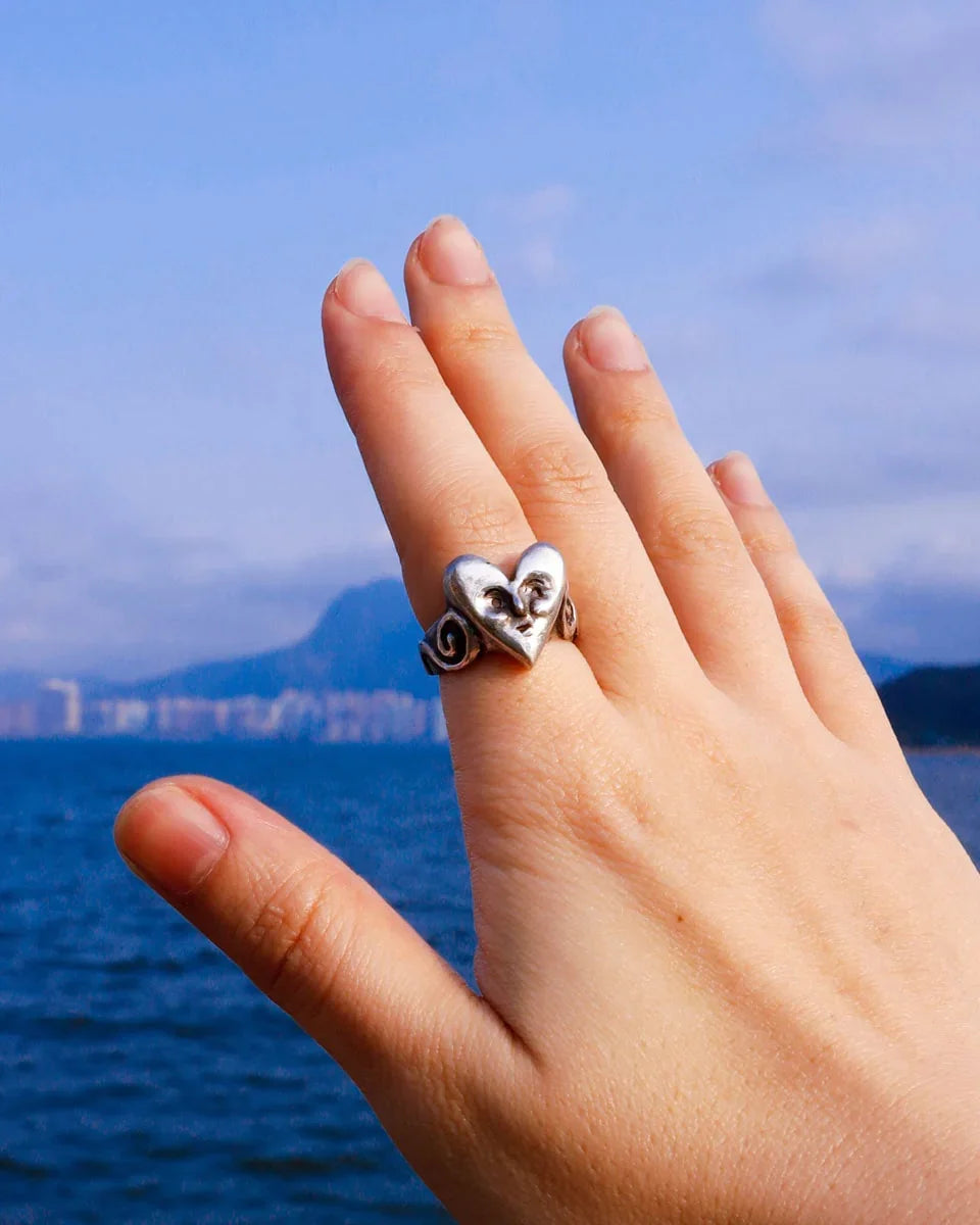heart face sterling ring with a spiral pattern on the ring band, handmade with lost wax casting, by fake plastic love