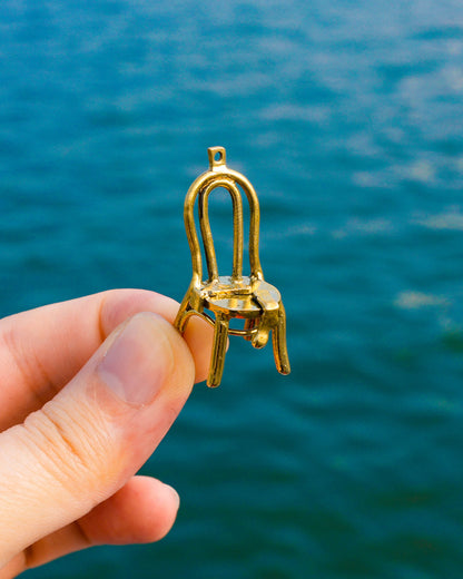 miniature brass chair with socks brass earring, handcrafted wearable sculpture