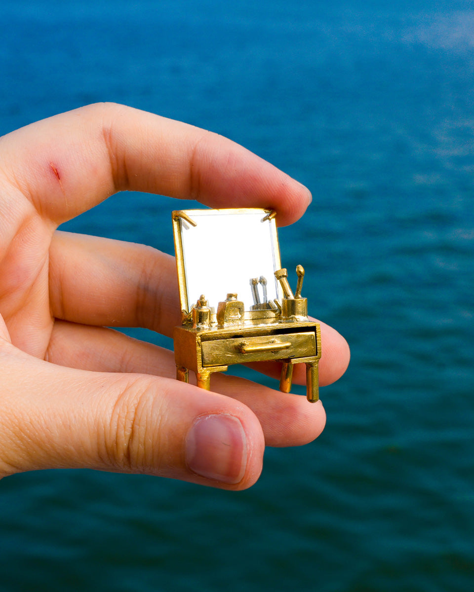 close up of handmade miniature Vanity table Jewellery - Functional Drawer and Mirror Pendant/Earring in brass