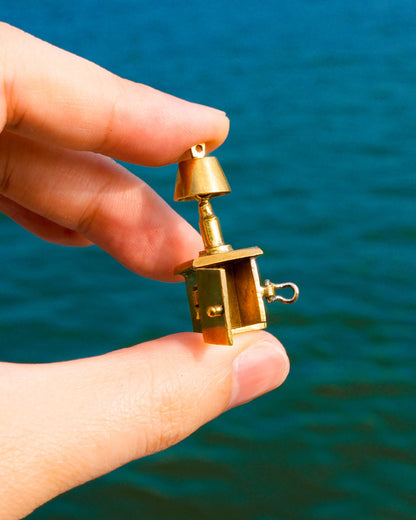 miniature bedside table locket earring with hinge opening in brass