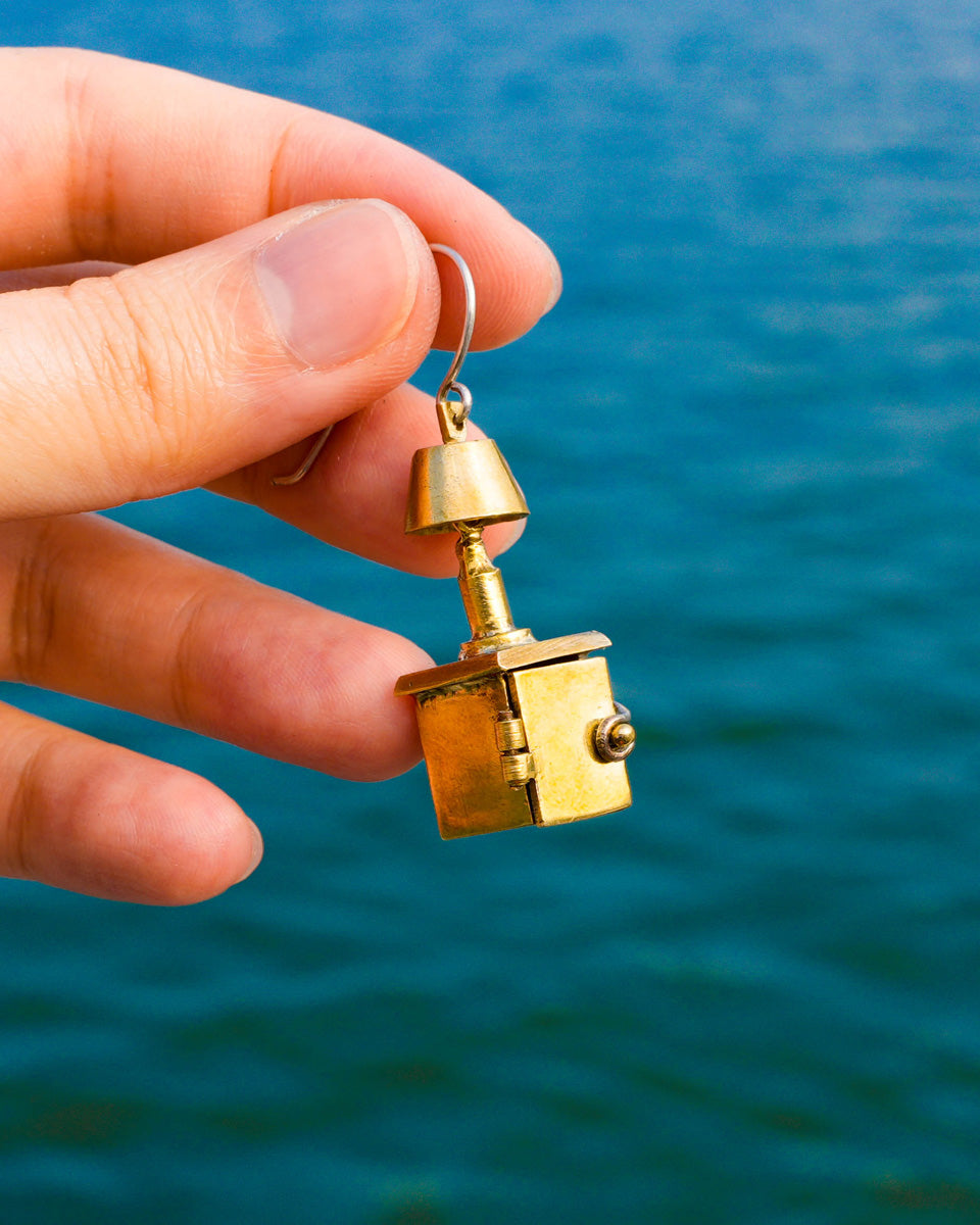 miniature bedside table locket earring with hinge opening in brass