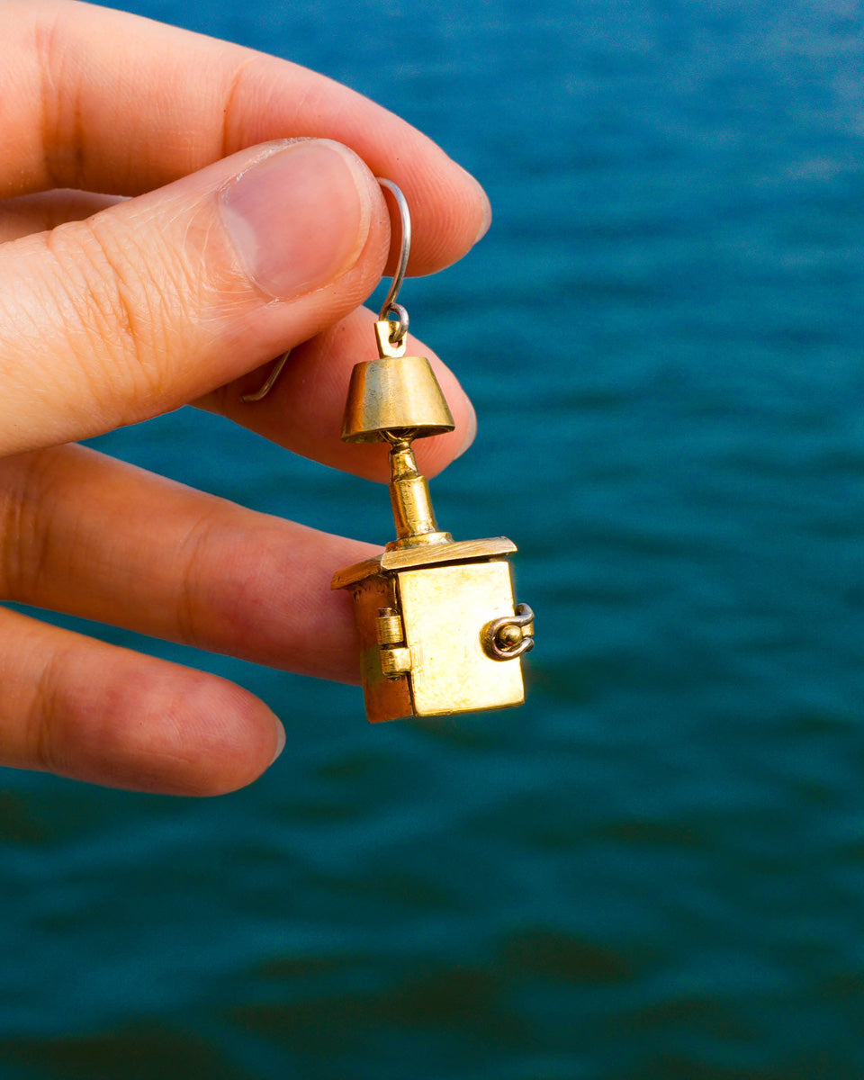 miniature bedside table locket earring with hinge opening in brass