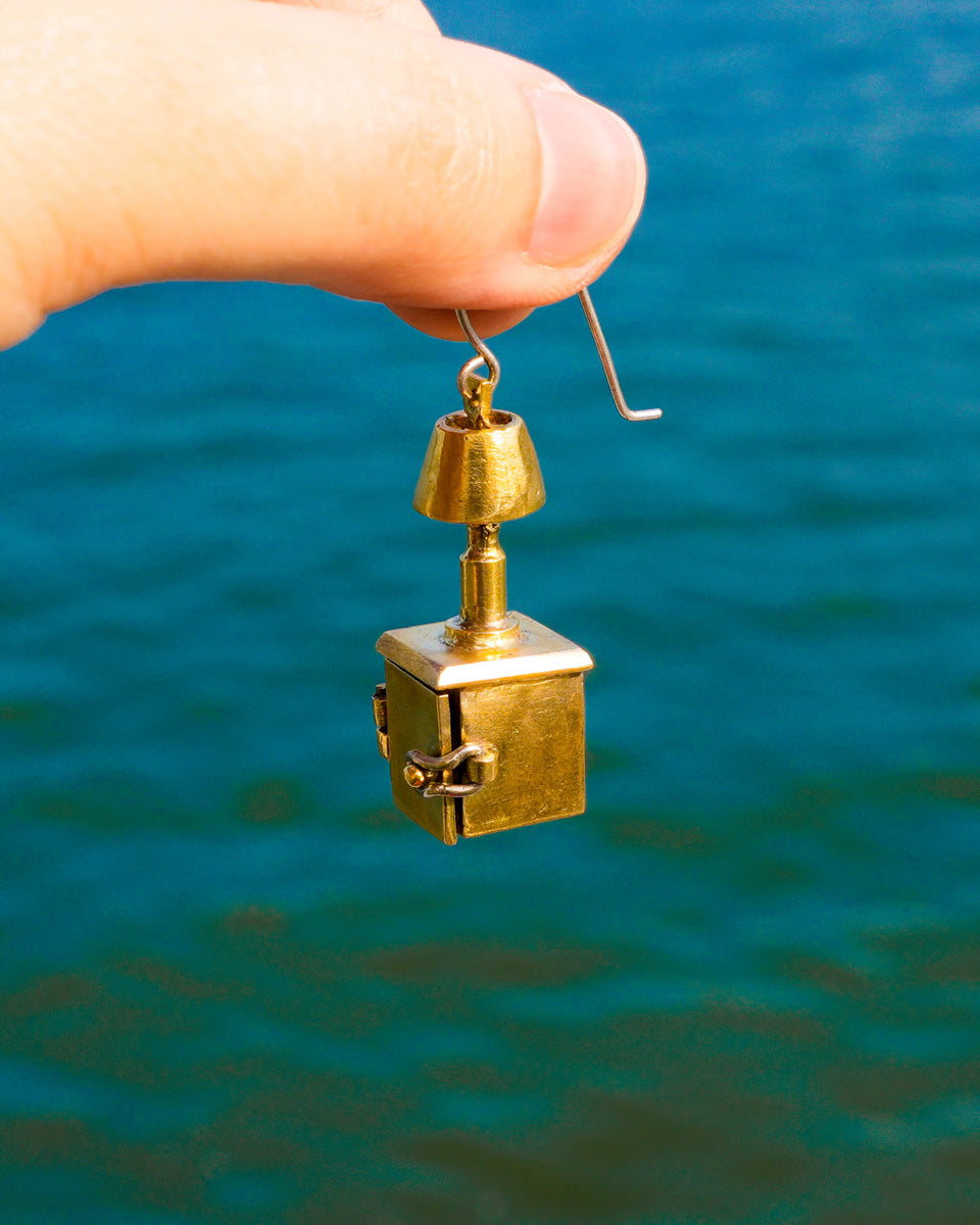 miniature bedside table locket earring with hinge opening in brass