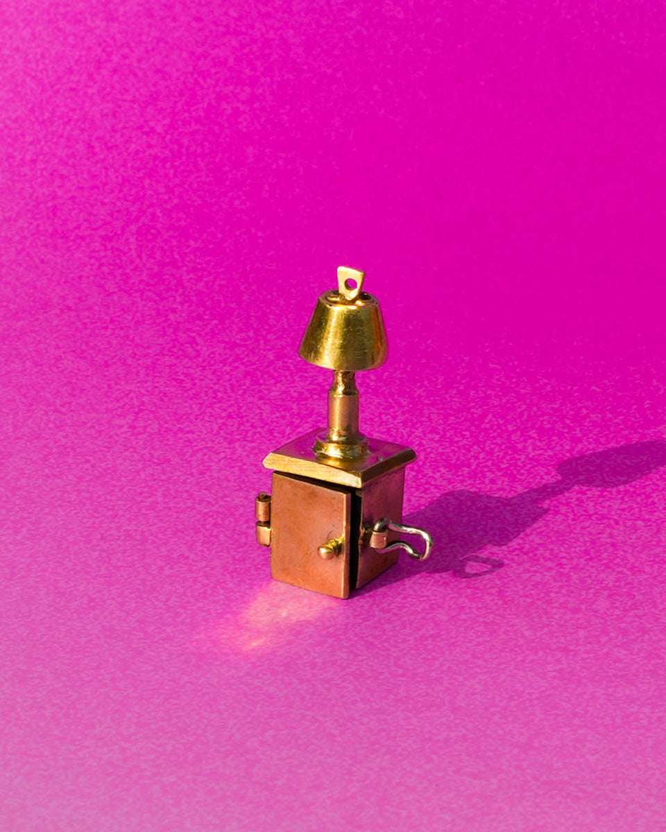 miniature bedside table locket earring with hinge opening in brass