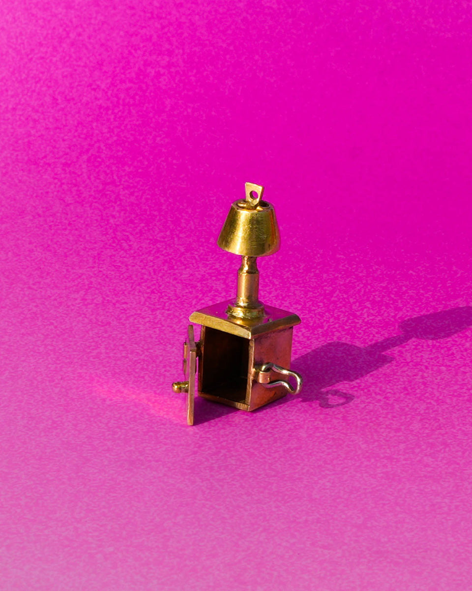 miniature bedside table locket earring with hinge opening in brass