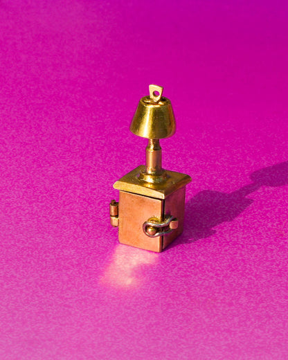 miniature bedside table locket earring with hinge opening in brass