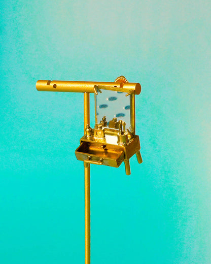 close up of handmade miniature Vanity table Jewellery - Functional Drawer and Mirror Pendant/Earring in brass