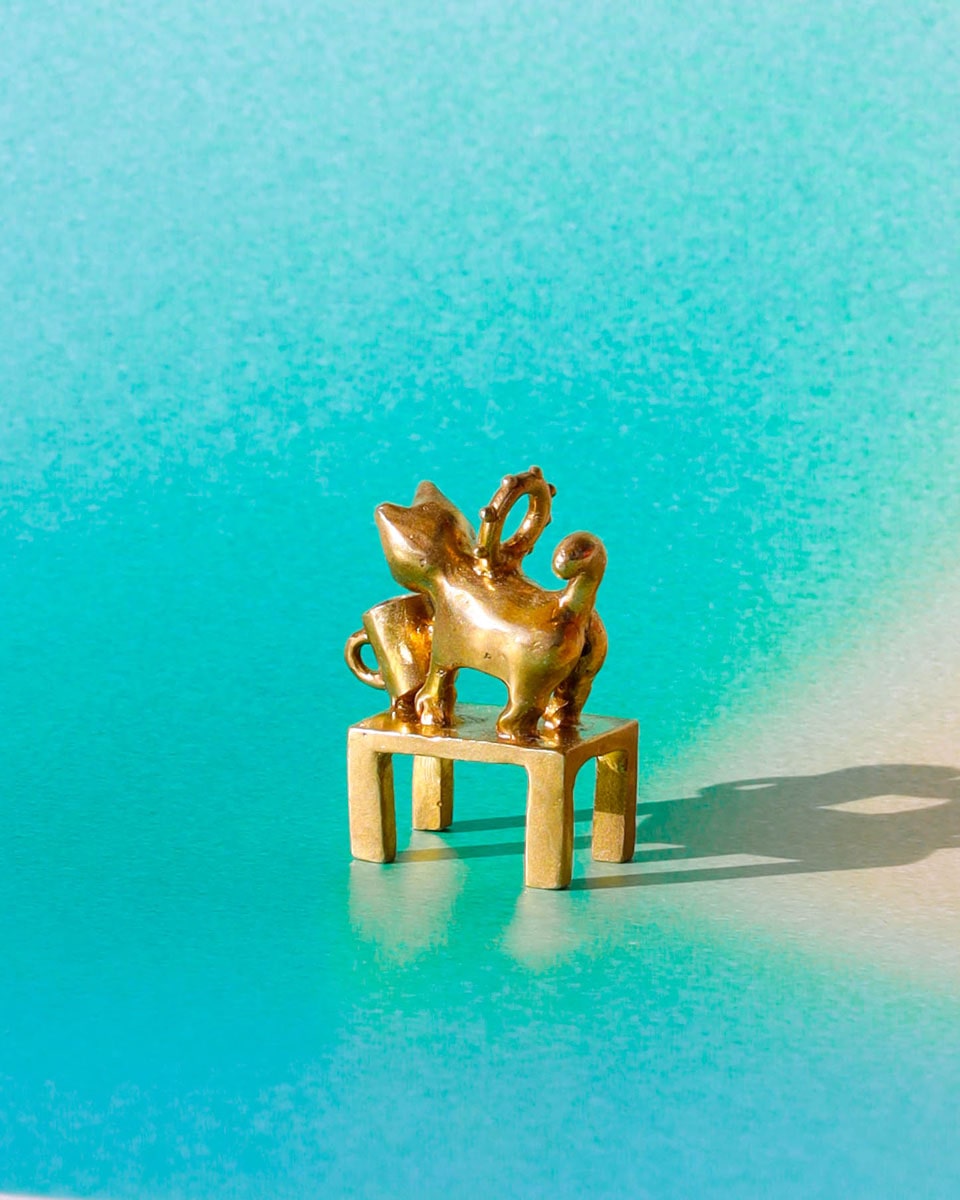 solid brass naughty kitty charm, cat pushing cup off table, set with cz stone, handmade jewellery, by fake plastic love