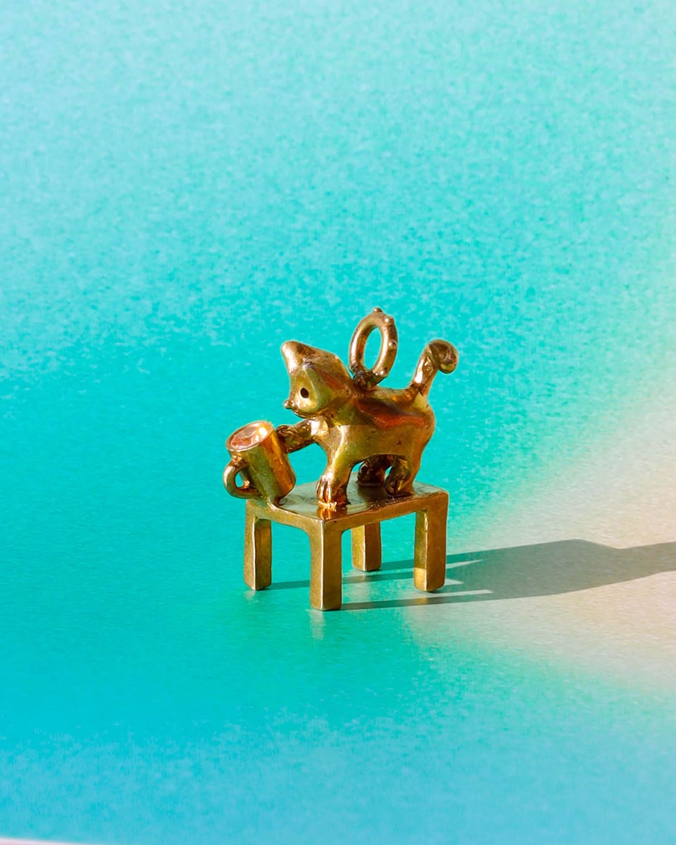 solid brass naughty kitty charm, cat pushing cup off table, set with cz stone, handmade jewellery, by fake plastic love