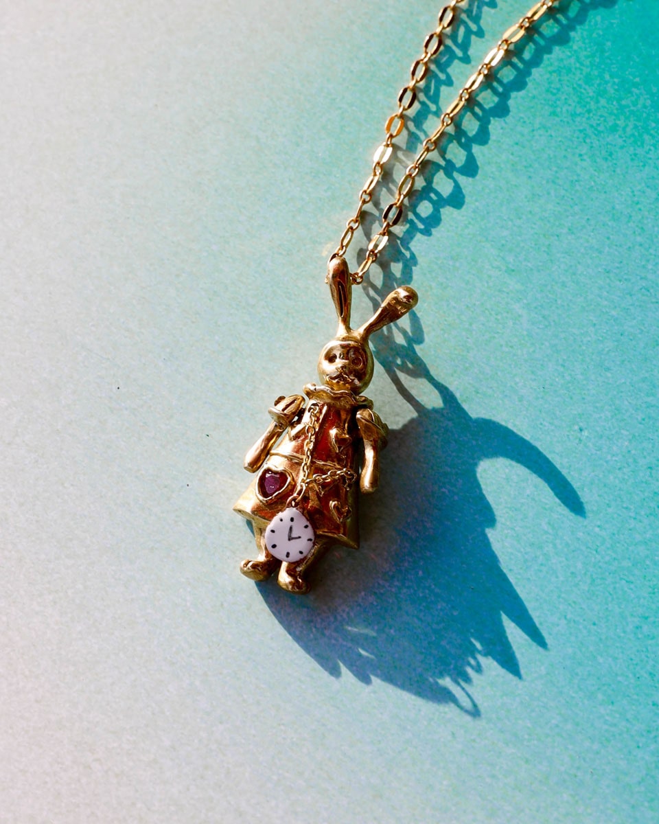 Articulated White Rabbit pendant in brass with moving parts, Alice in wonderland inspired handmade jewellery, with enamel clock, and magenta CZ stone, by fake plastic love