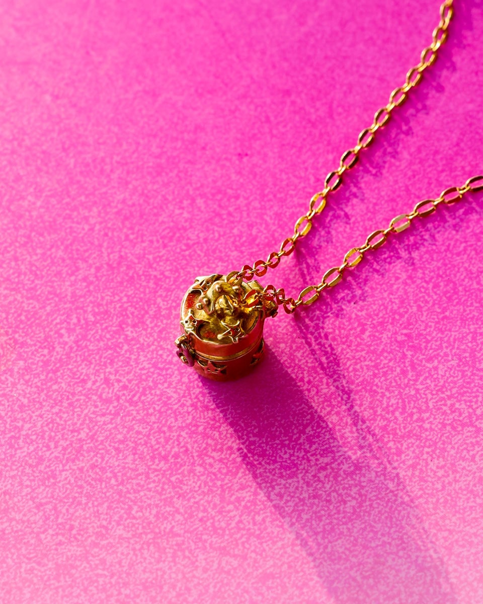 a solid brass locket with stars design, handmade small container locket pendant
