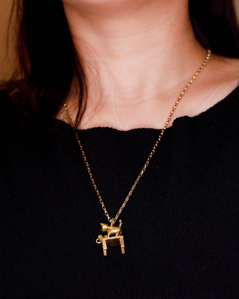 solid brass naughty kitty charm, cat pushing cup off table, set with cz stone, handmade jewellery, by fake plastic love