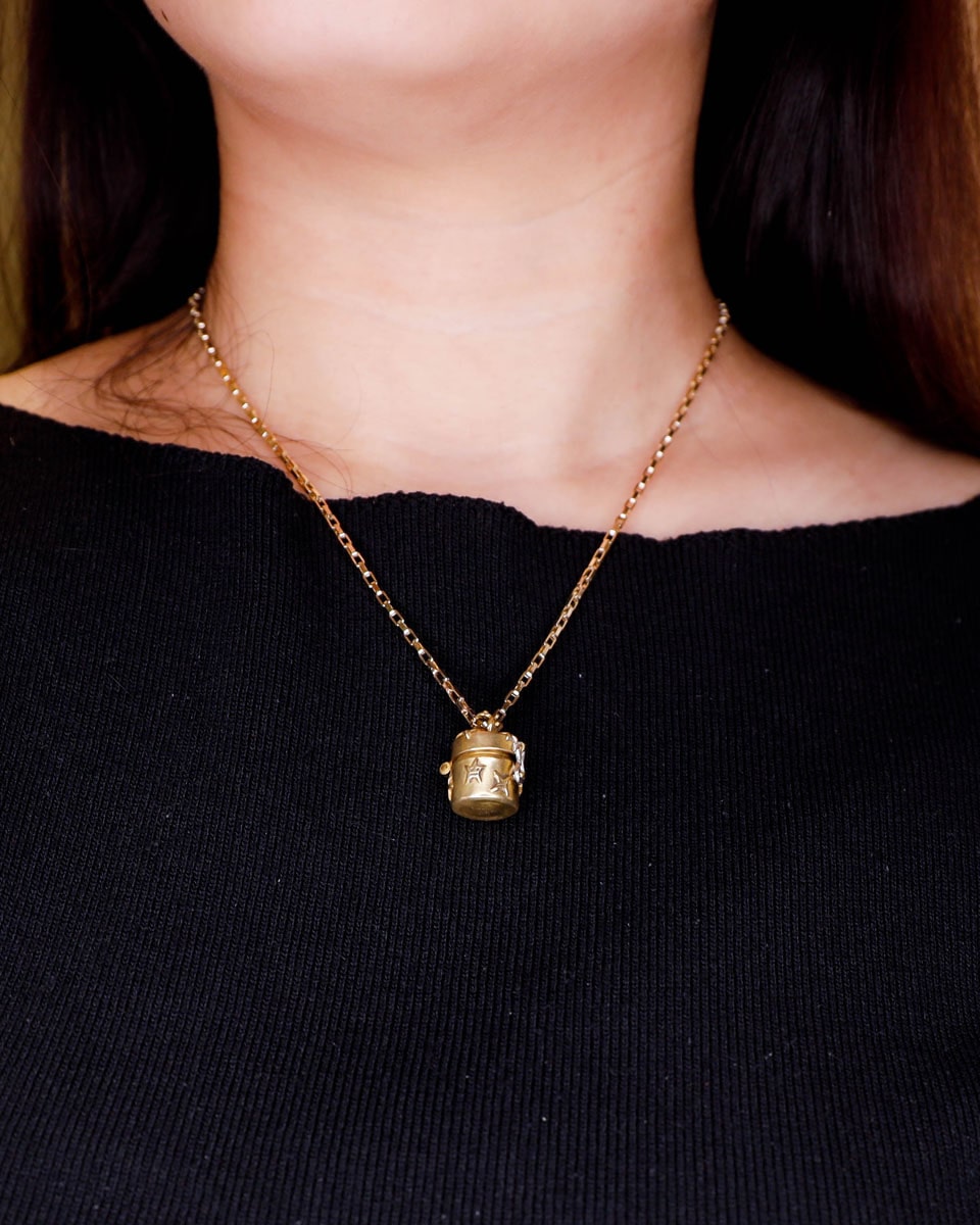 a solid brass locket with stars design, handmade small container locket pendant