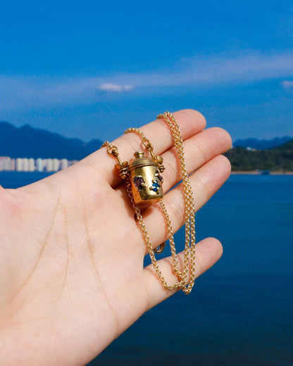 The Alchemist Locket Necklace, a handmade brass tiny container locket with cz stones and flowers details with gold plated chain, crafted by fake plastic love
