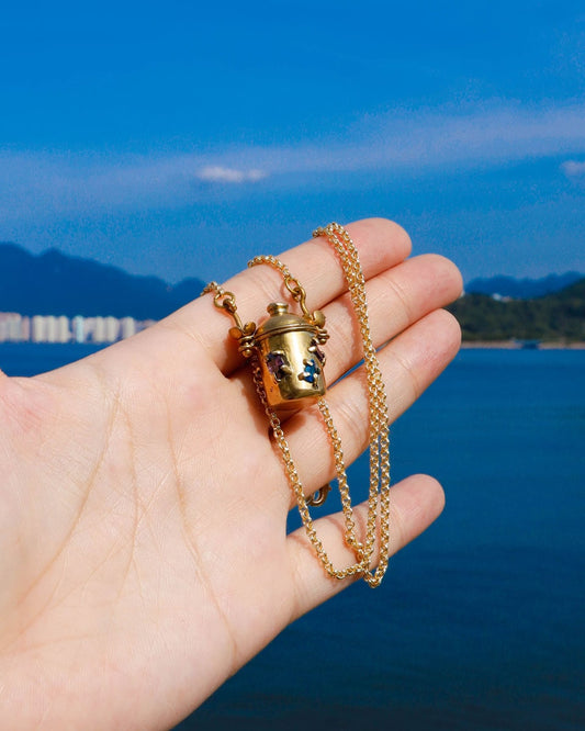 The Alchemist Locket Necklace, a handmade brass tiny container locket with cz stones and flowers details with gold plated chain, crafted by fake plastic love