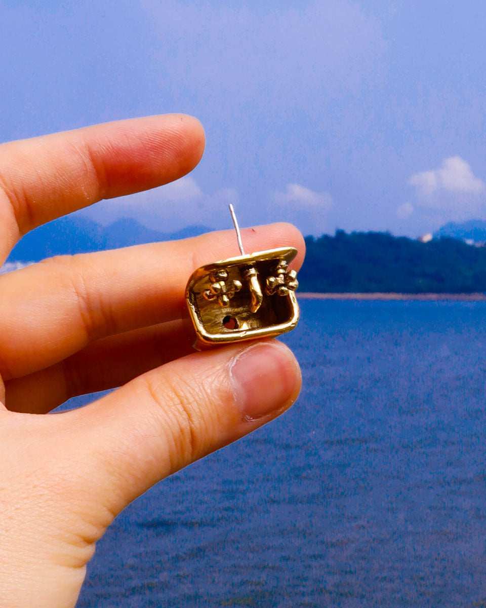 Miniature tiny sink earring in solid brass with sterling silver post, featuring movable faucet knobs and a detailed cast design inspired by a household bathroom sink