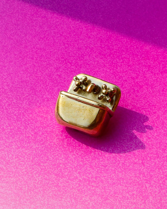 Miniature tiny sink earring in solid brass with sterling silver post, featuring movable faucet knobs and a detailed cast design inspired by a household bathroom sink