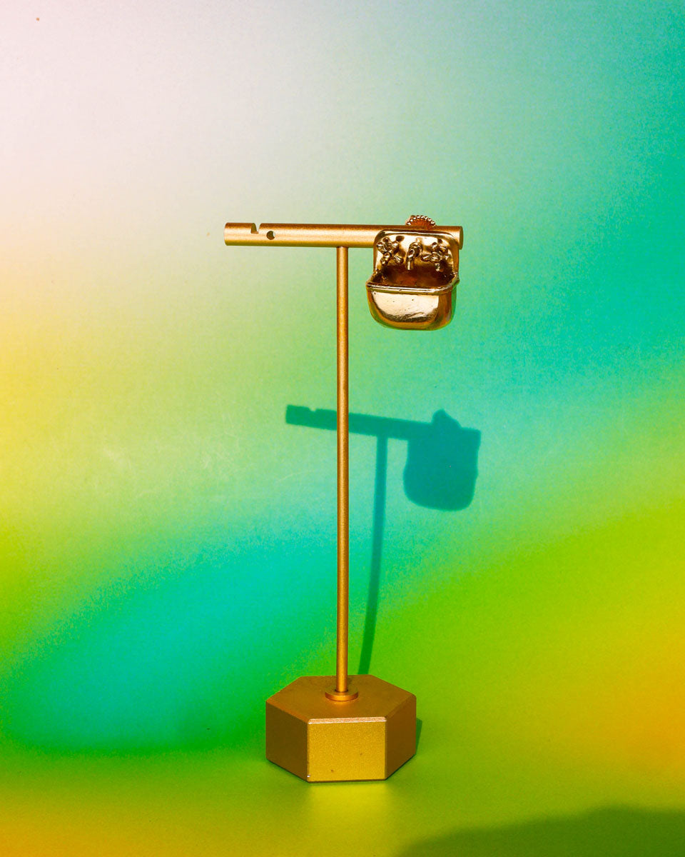 Miniature tiny sink earring in solid brass with sterling silver post, featuring movable faucet knobs and a detailed cast design inspired by a household bathroom sink