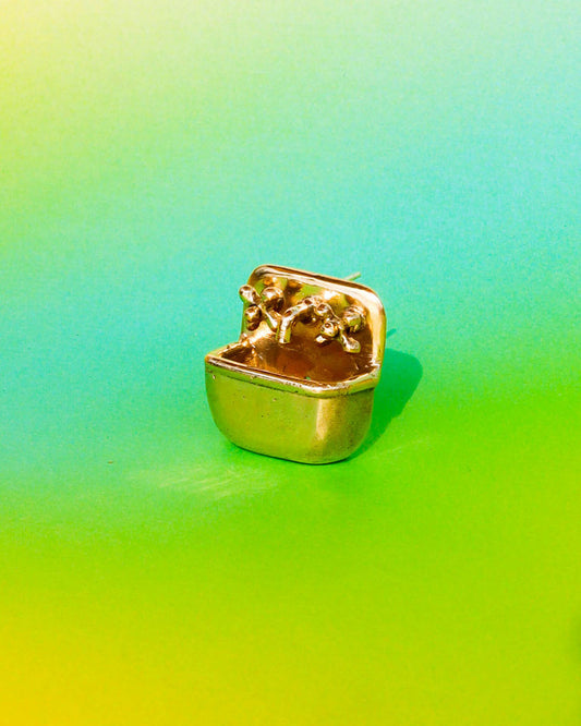 Miniature tiny sink earring in solid brass with sterling silver post, featuring movable faucet knobs and a detailed cast design inspired by a household bathroom sink