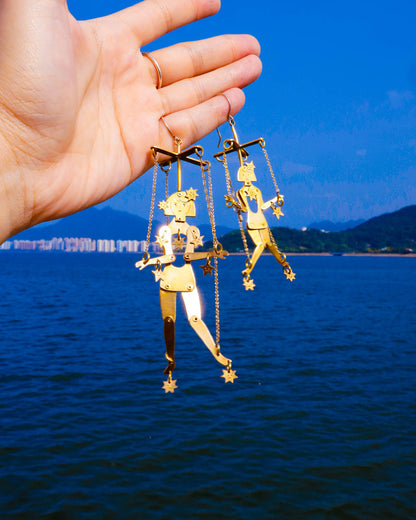 Kinetic puppet earrings with moving joints in brass, handmade statement jewelry inspired by stars and extra-terrestrial