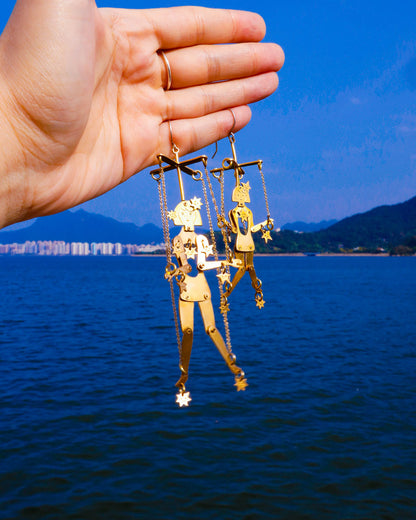 Kinetic puppet earrings with moving joints in brass, handmade statement jewelry inspired by stars and extra-terrestrial