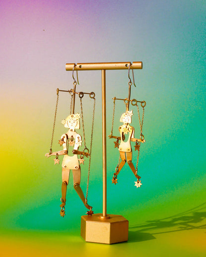 Handmade articulated puppet earrings in brass, “The Person Controlled By The Stars Mini” and "“The Person Controlled By The Stars", sculptural statement jewelry with jointed moving parts