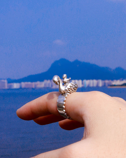Sculptural sterling silver swan ring with cygnet perched on its back