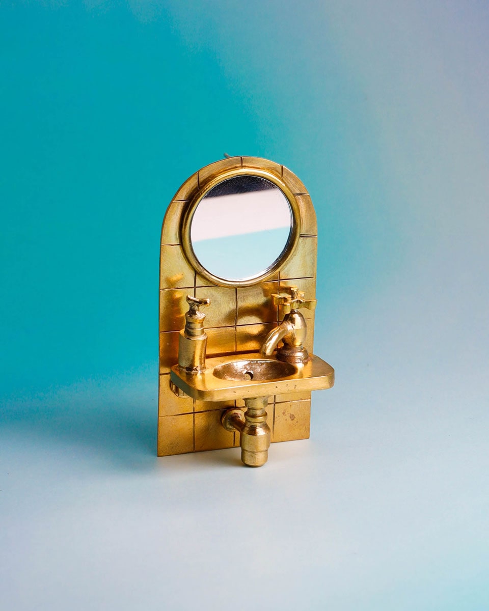 Wearable miniature sink art jewelry, handcrafted in brass