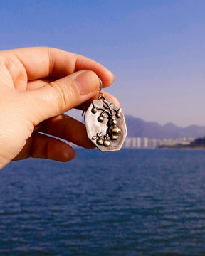 Handcrafted earrings inspired by tangerines, a Chinese symbol of good luck and prosperity for the Lunar New Year