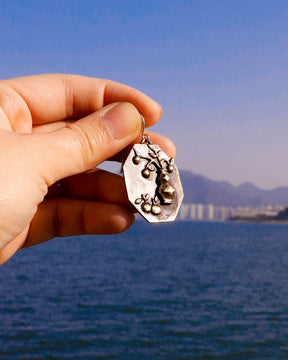 Handcrafted earrings inspired by tangerines, a Chinese symbol of good luck and prosperity for the Lunar New Year