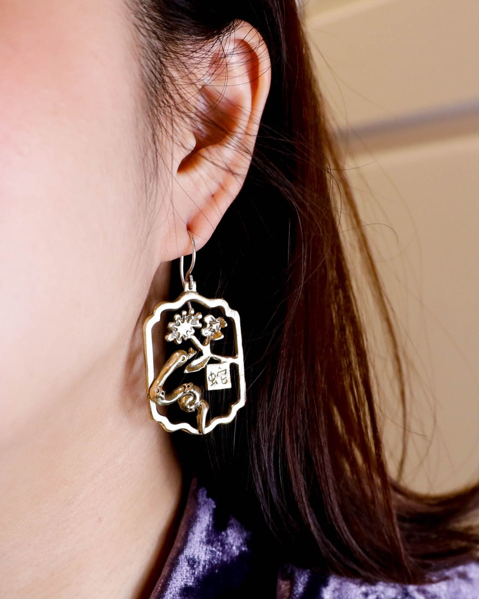 Handcrafted Year of the Snake earrings inspired by Chinese New Year 2025, designed by Scarlett Poon of Fake Plastic Love