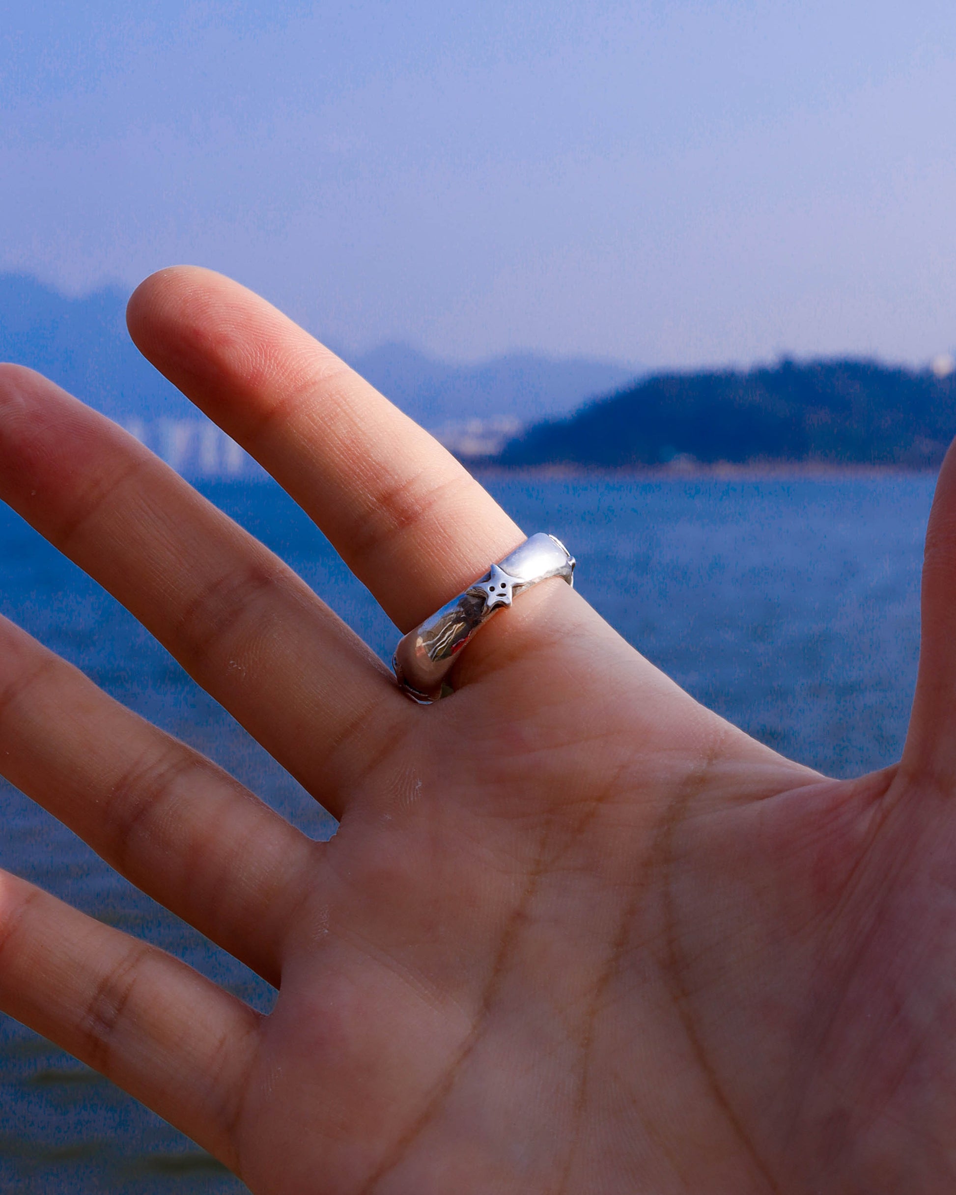 A Puke Of Stars Ring, a solid sterling silver ring with stars design on the signet ring