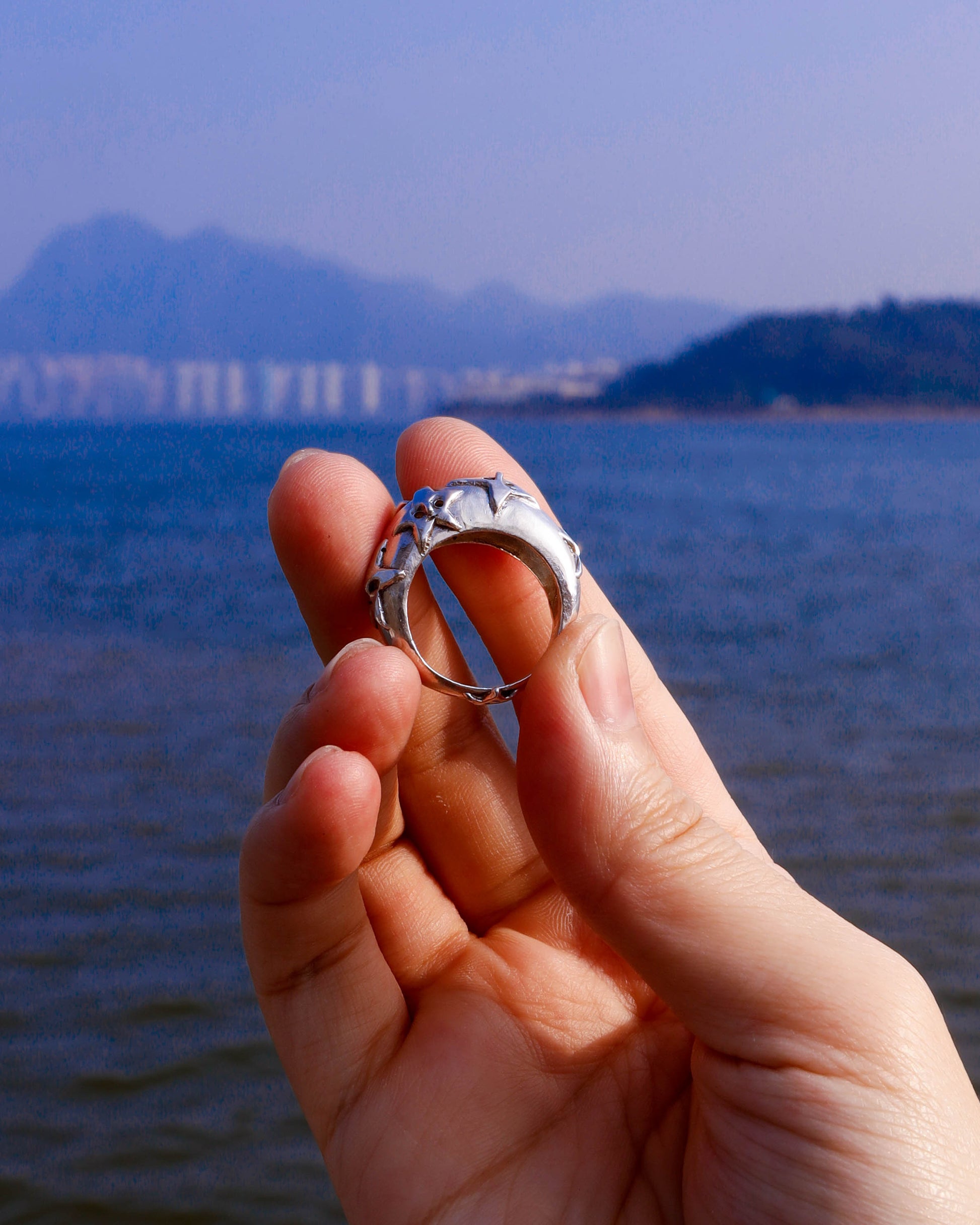 A Puke Of Stars Ring, a solid sterling silver ring with stars design on the signet ring