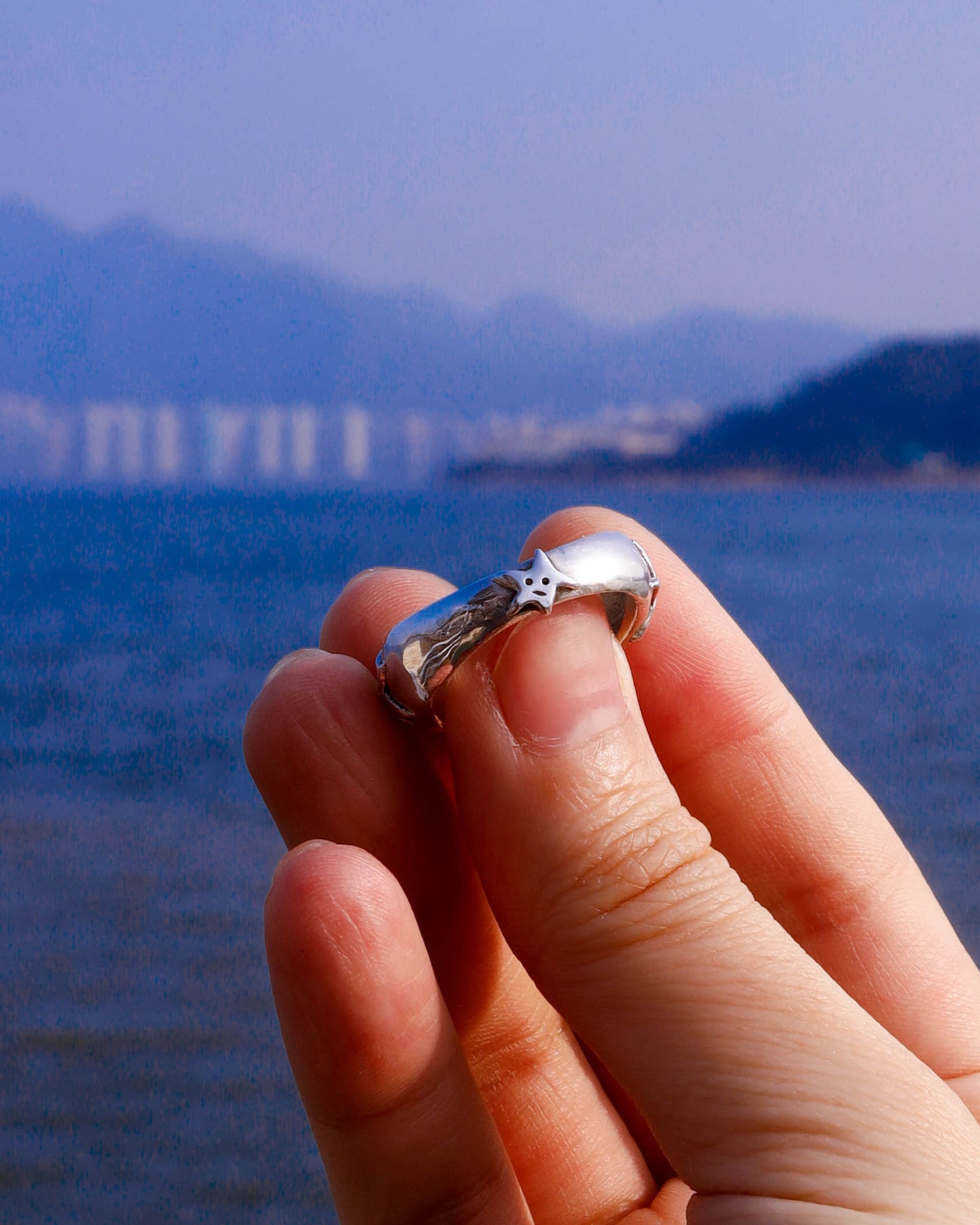 A Puke Of Stars Ring, a solid sterling silver ring with stars design on the signet ring