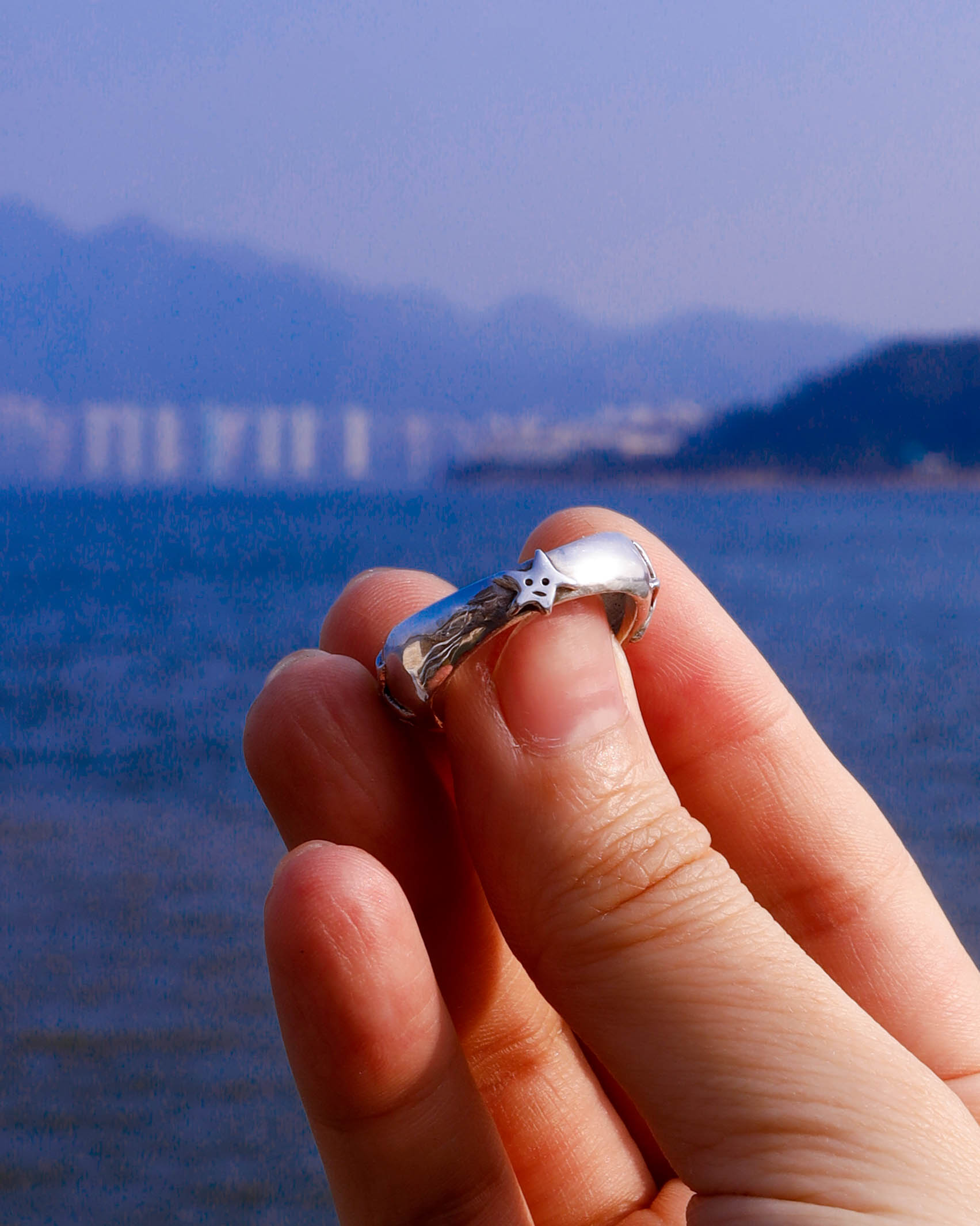 A Puke Of Stars Ring, a solid sterling silver ring with stars design on the signet ring